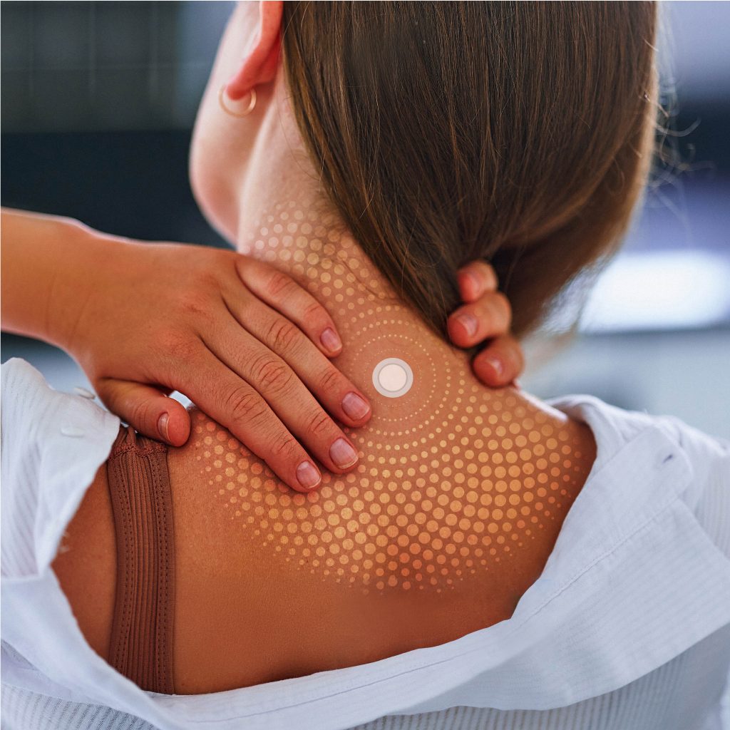 Woman wearing a LifeWave patch on her neck
